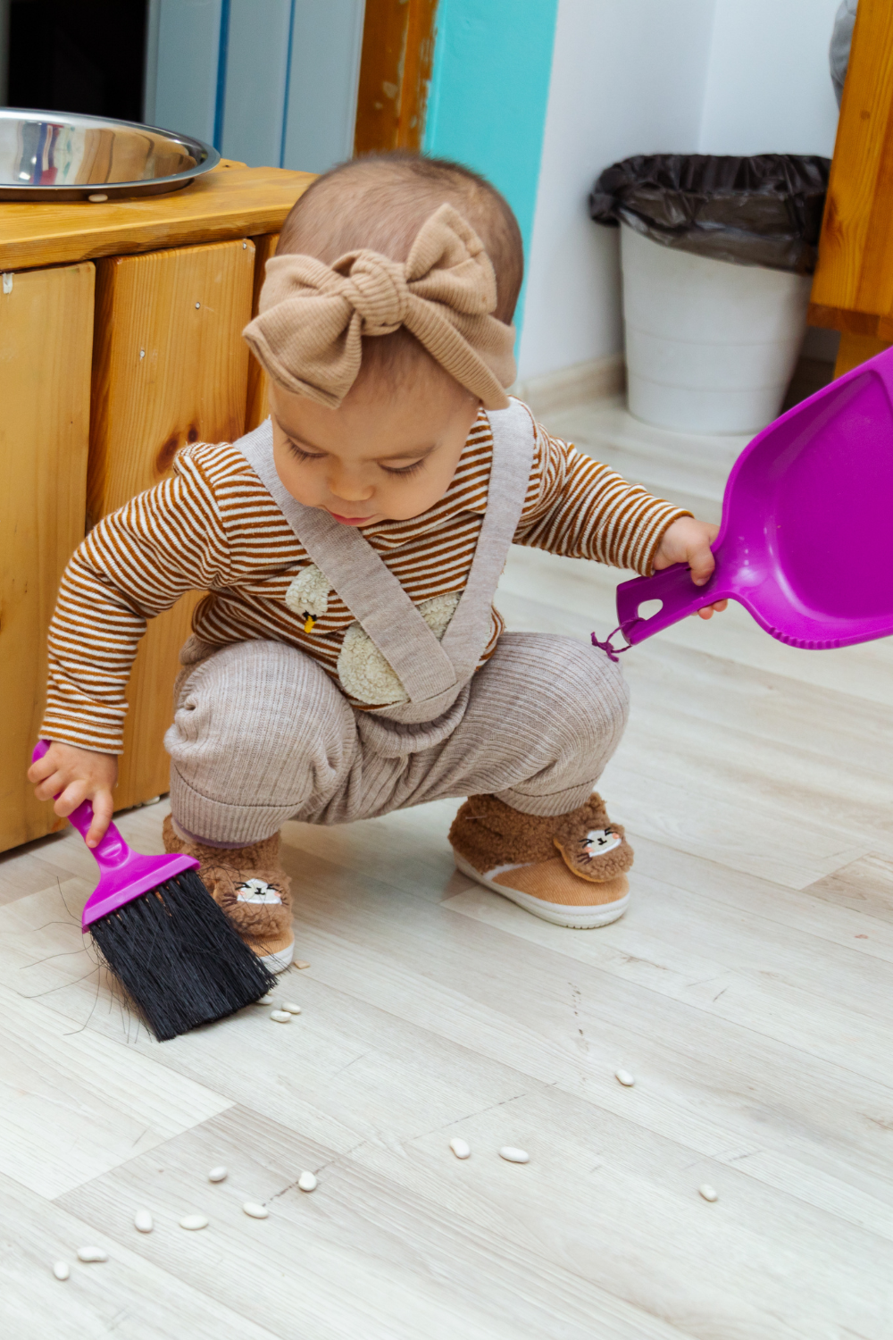 Toddler doing Practical Life